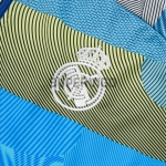 Chandal Real Madrid 2025/2026 en Azul y Verde a Rayas